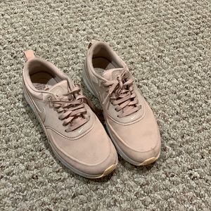 Blush colored Nike shoes